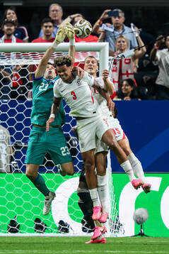 Nico O'Reilly and Dan Burn of England against goalkeeper