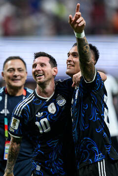 Lionel Messi and Lautaro Martinez of Argentina celebrate