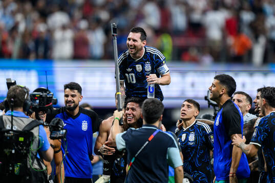 Lionel Messi of Argentina celebrate with teammates