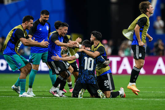 Lionel Messi of Argentina celebrate with teammates