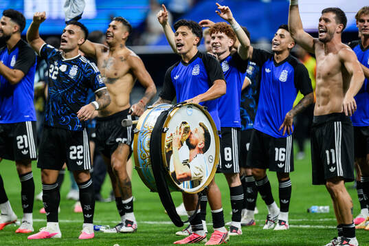Lisandro Martinez of Argentina celebrates with a drum
