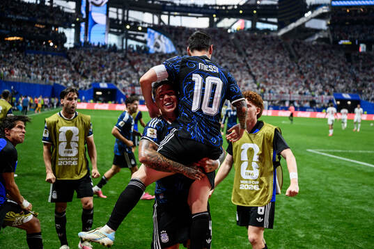 Enzo Fernandez and Lionel Messi of Argentina celebrate