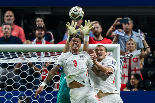 Nico O'Reilly and Dan Burn of England and goalkeeper