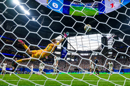 Goalkeeper Jordan Pickford of England lets in the 1-1 goal
