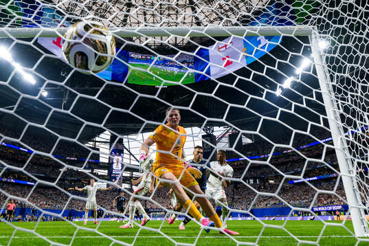 Lautaro Martinez of Argentina scores the 1-2 goal behind