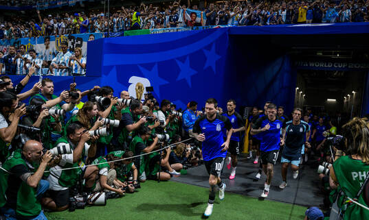 Lionel Messi of Argentina enters the pitch for warm-up