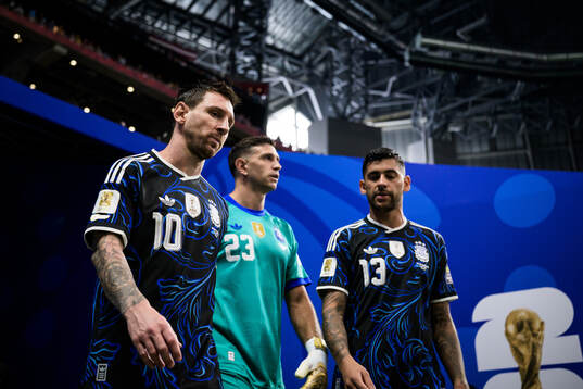 Lionel Messi, goalkeeper Emiliano Martinez and Cristian