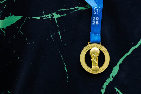 En Skouted spelare med guldmedalj