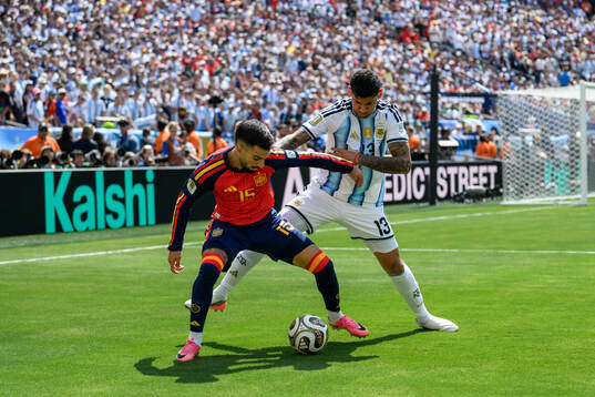 Alex Baena of Spain and Cristian Romero of Argentina