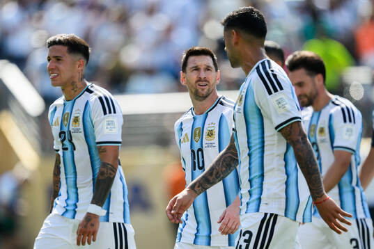 Enzo Fernandez, Lionel Messi and Cristian Romero of