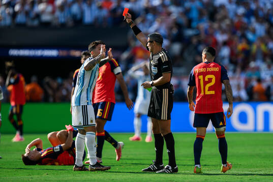 Enzo Fernandez of Argentina is shown a red card by Referee