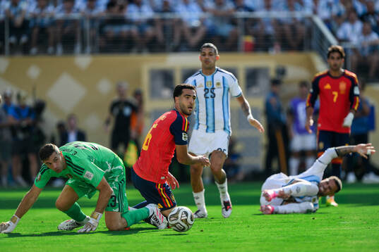 goalkeeper Emiliano Martinez of Argentina and Mikel Merino