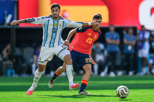 Leandro Paredes of Argentina and Pedri of Spain