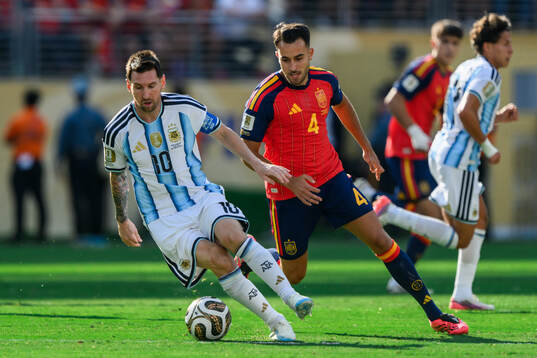Lionel Messi of Argentina and Eric Garcia of Spain