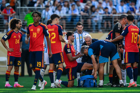 Lionel Messi of Argentina and Mikel Merino of Spain