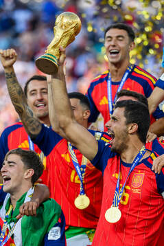 Rodri of Spain hoists the trophy