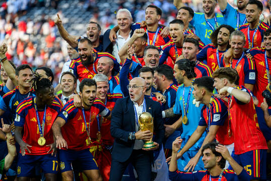 Head coach Luis De La Fuente Castillo of Spain hoists the