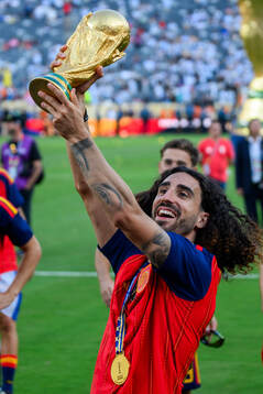Marc Cucurella of Spain celebrates with the trophy
