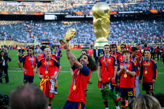 Marc Cucurella of Spain celebrates with the trophy