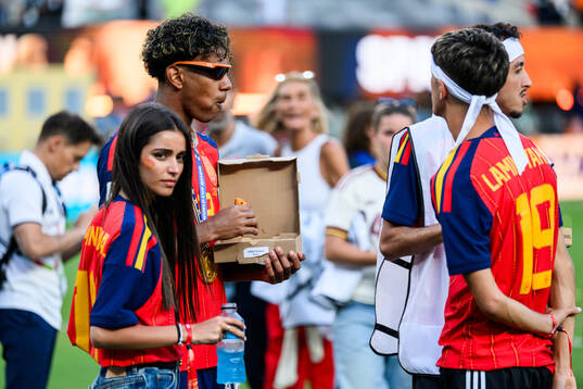 Lamine Yamal of Spain eats pizza