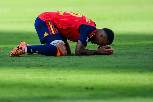 Pedro Porro of Spain celebrates