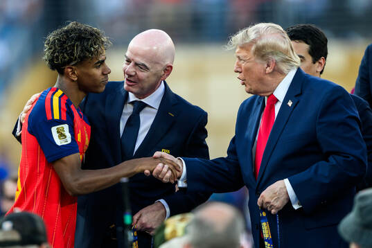 Lamine Yamal of Spain with Gianni Infantino, President of