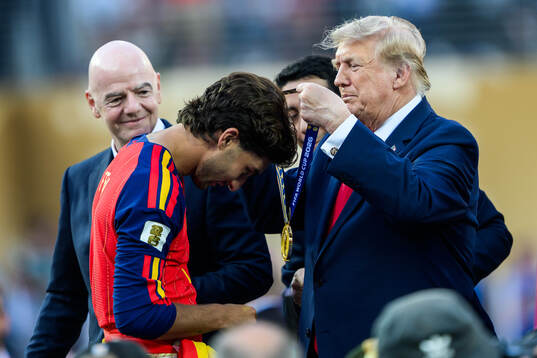 Ferran Torres of Spain is given a gold medal by Donald