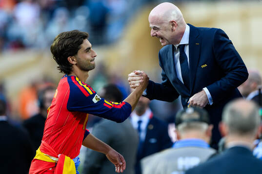 Ferran Torres of Spain and Gianni Infantino, President of