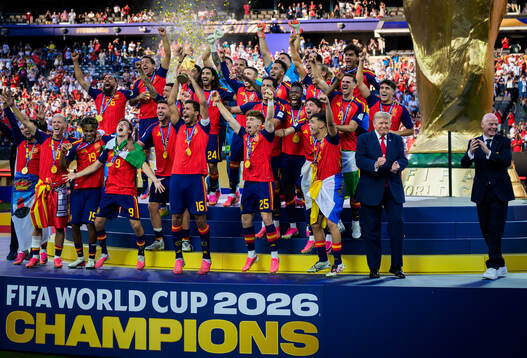 Rodri of Spain hoists the winner’s trophy with US