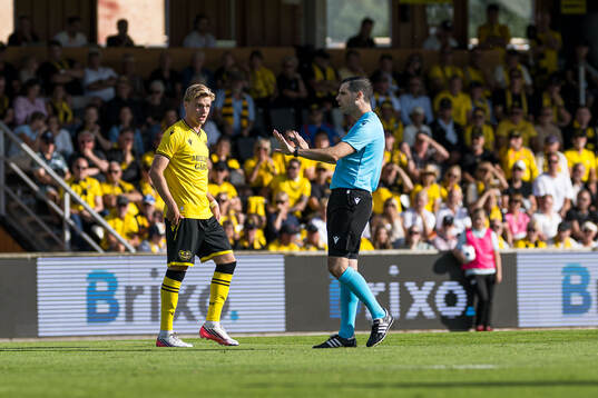 Jeppe Kjaer of Mjällby and Referee Matthew De Gabriele
