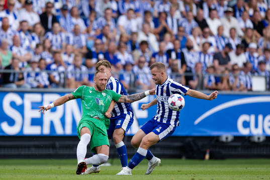 Mikhel Ainsalu of Tallinna FCI Levadia and Jonas Bager of