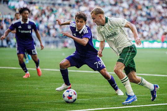 Ali Maamar of Anderlecht and Victor Lind of Hammarby