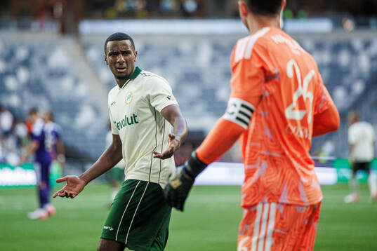 Paulos Abraham of Hammarby and goalkeeper Colin Coosemans