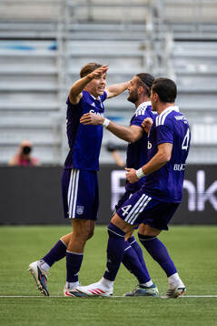 Danylo Sikan of Anderlecht celebrates with teammates