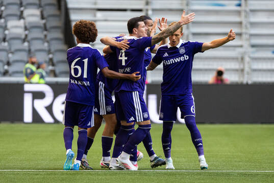 Danylo Sikan of Anderlecht celebrates with teammates