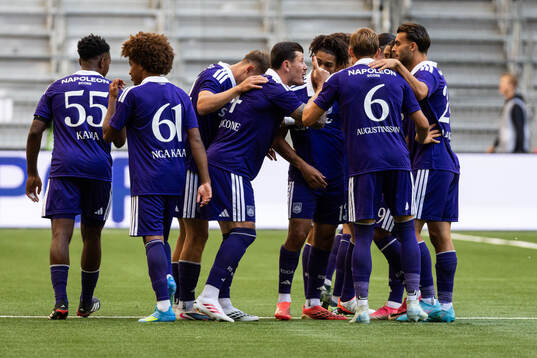 Danylo Sikan of Anderlecht celebrates with teammates