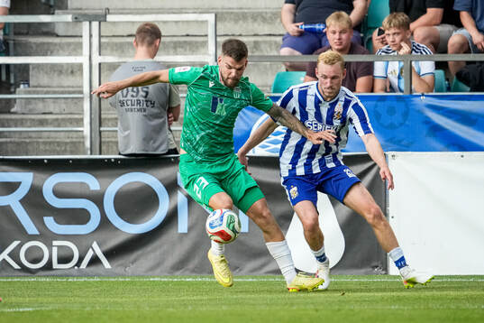 Frank Liivak of Levadia Tallinn and Adam Bergmark Wiberg of