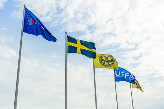 The UEFA flag, Mjällby flag and the Swedish flag