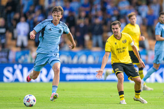 Mykola Kukharevych of Slovan Bratislava and Jesper