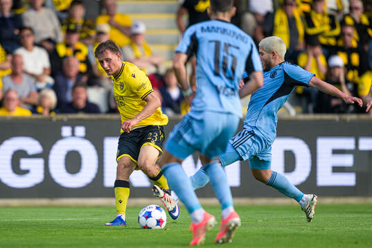Aki Samuelsen of Mjällby and Cristian Martinez of Slovan