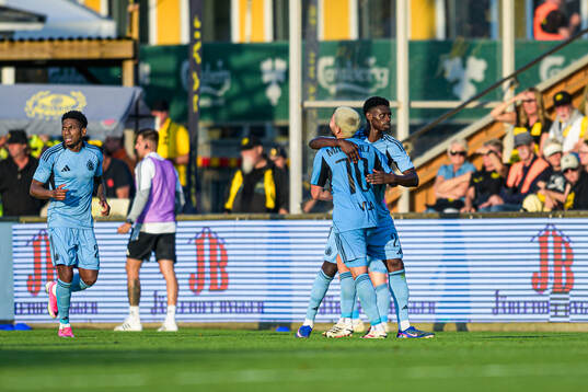 Cristian Martinez and Suleiman Camara Sanneh of Slovan