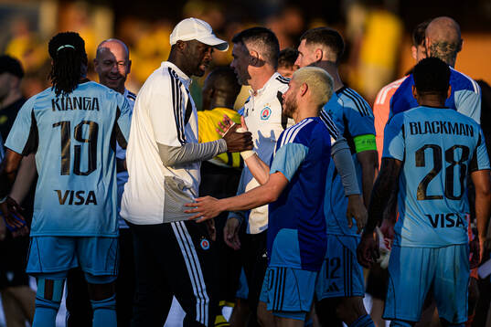Coach Yaya Toure of Slovan Bratislava celebrates