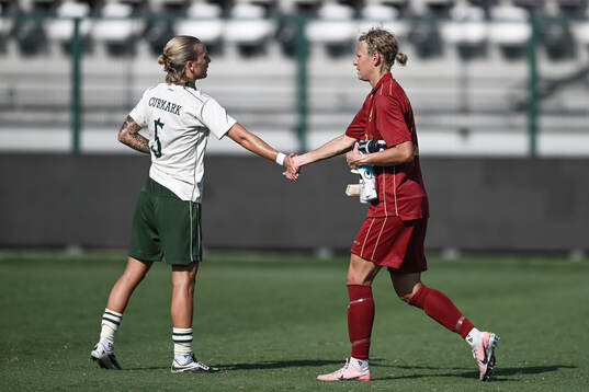 Filippa Curmark and goalkeeper Cajsa Andersson of Hammarby