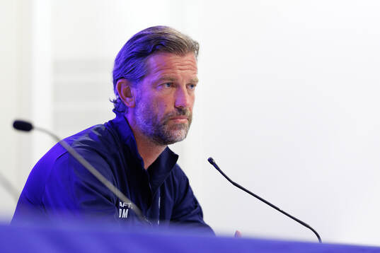 head coach Rik De Mil