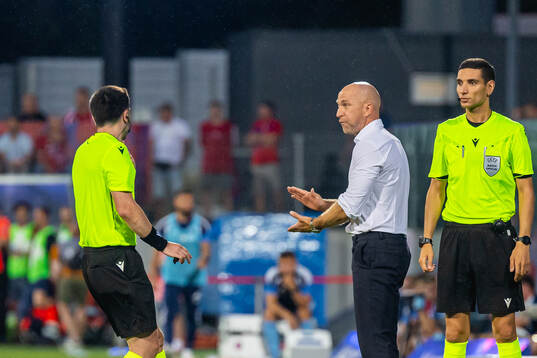 Coach Henrik Rydstrom of Hammarby discuss with referee