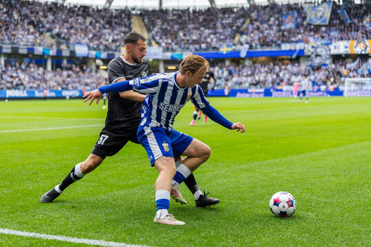 Matties Volckaert of Gent and Noah Tolf of IFK Göteborg