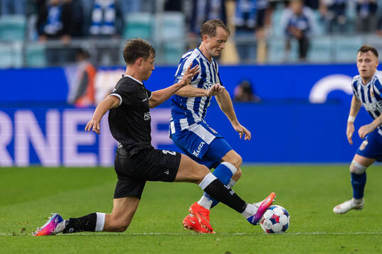 Tibe De Vlieger of Gent and Sam Larsson of IFK Göteborg