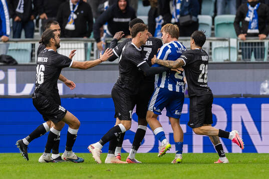 Noah Tolf of IFK Göteborg and players of Gent argue