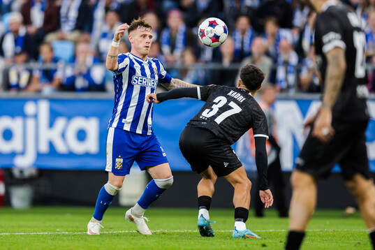 Tobias Heintz of IFK Göteborg and Abdelkahar Kadri of Gent