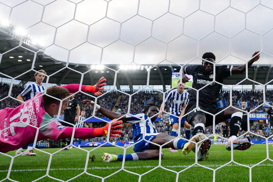 Goalkeeper Viktor Andersson and Rockson Yeboah  of IFK